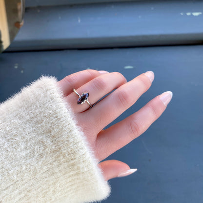 a 1.57 ct violet spinel in a temporary ring mounting in diffused winter sunlight