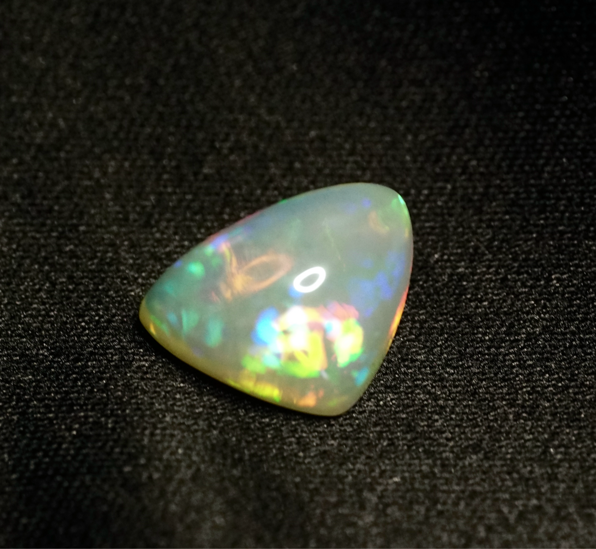 8.73 ct Ethiopian Opal on a black backdrop