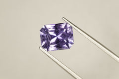 Purple gemstone on a beige background