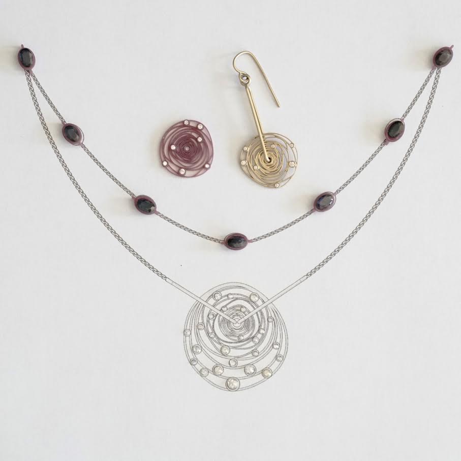 a technical view and wax models of custom jewelry with heirloom family gemstones lays on a matte white background