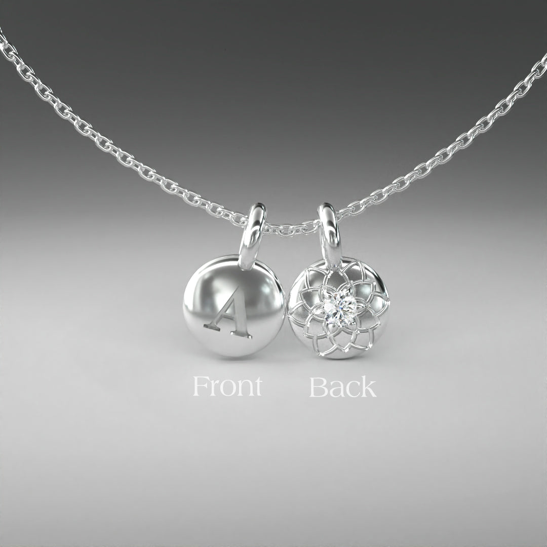 A computer rendering of a pair of white gold and diamond pendants on a chain