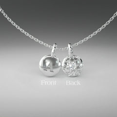 A computer rendering of a pair of white gold and diamond pendants on a chain