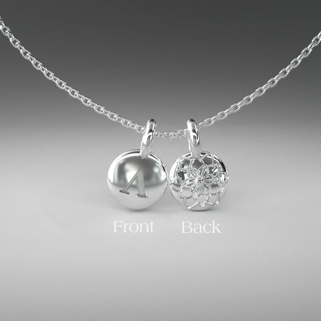 A computer rendering of a pair of white gold pendants on a chain