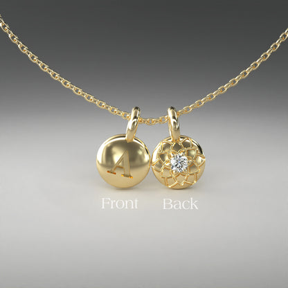 A computer rendering of a pair of yellow gold and diamond pendants on a chain