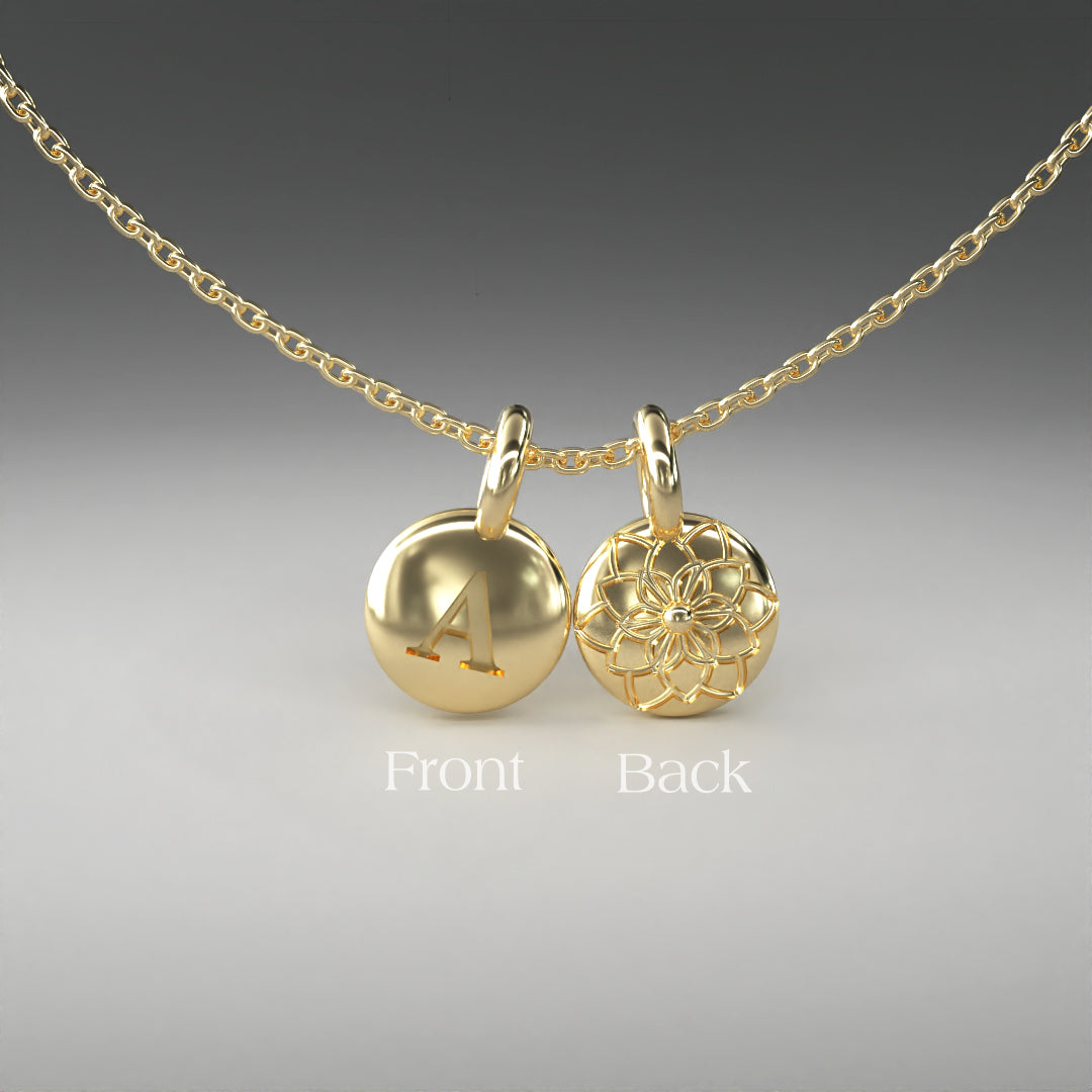 A computer rendering of a pair of yellow gold pendants on a chain