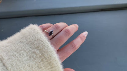 a 1.57 ct violet spinel in a temporary ring mounting in diffused winter sunlight