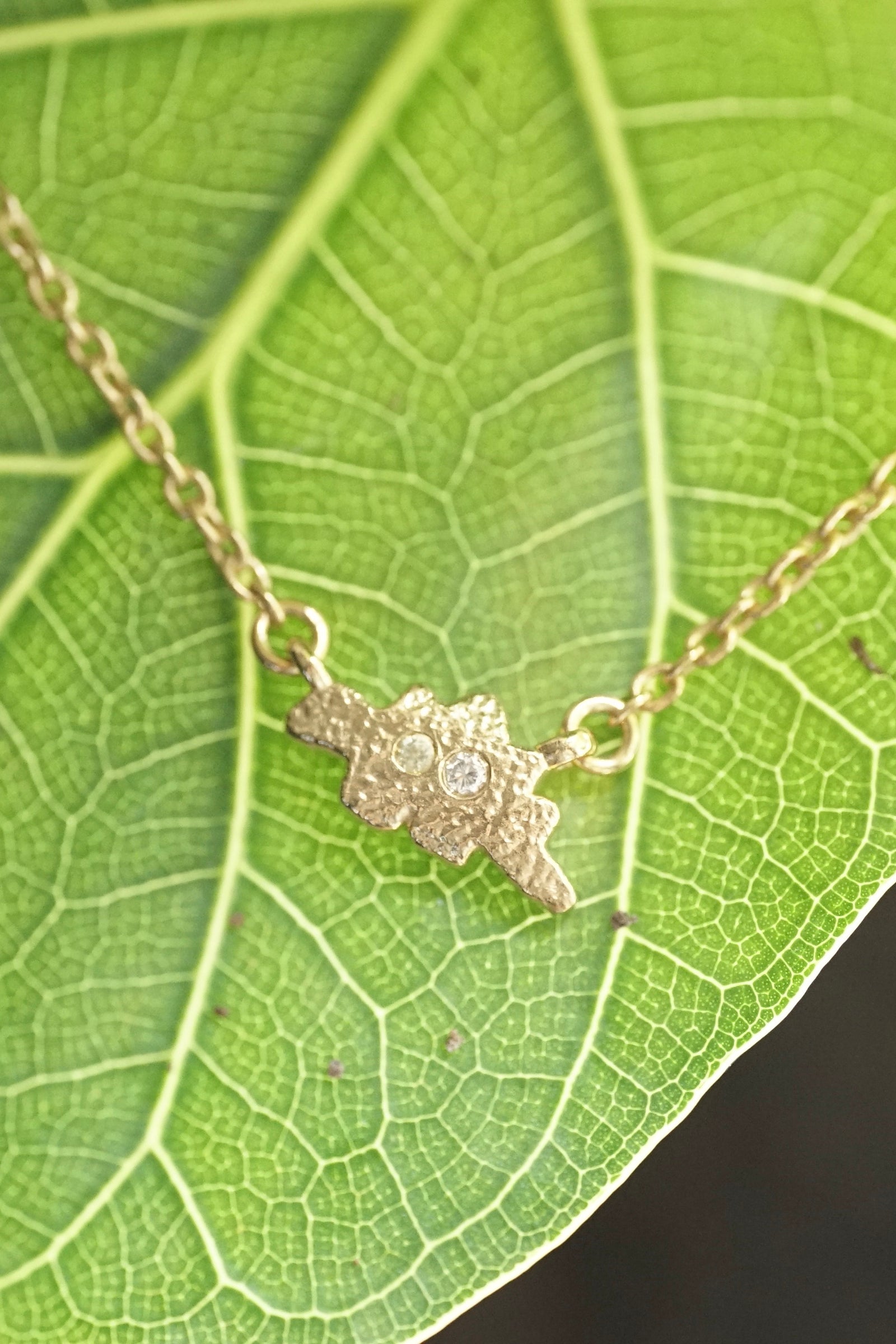 a golden dinosaur chicken nugget on a green leaf