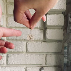 a video of the cosmos earrings spinning